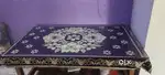 Central table with glass and clothes cover