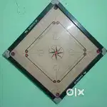 Standard size carrom board.