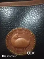 Dooney Brand hand bag leather and weather