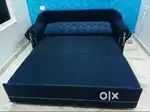 Navy blue fabric sofa cum bed with storage