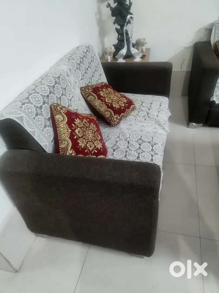 5 seater sofa set with two puffy and two center Table