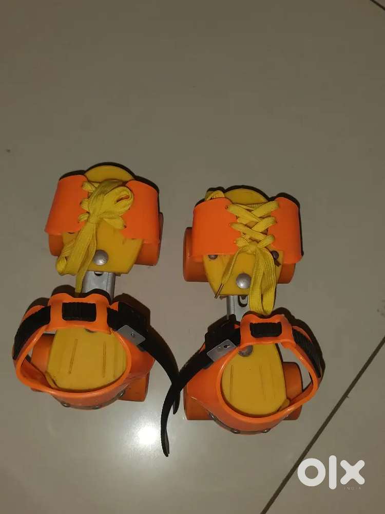Adjustable kids dry Roller Skates,Bright Orange and in good condition