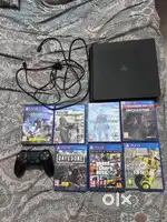 Sony Playstation 4 Slim with game discs