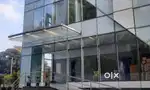 Refurbished glass partitionwork. Office workstation. Office floor mat