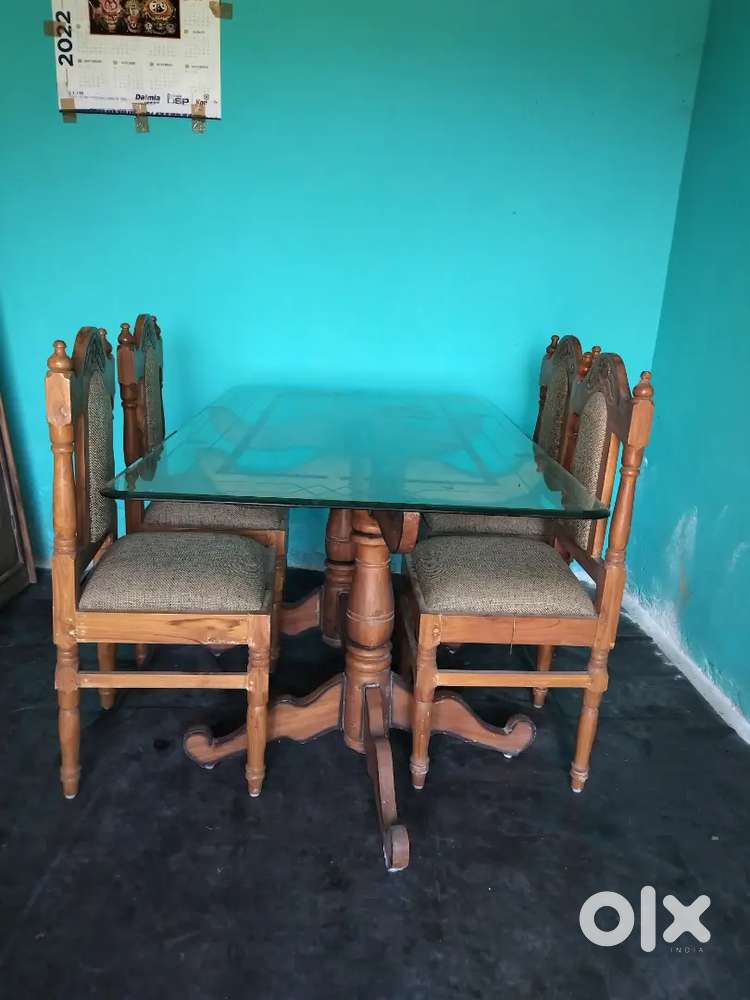 Designed glass top dining table (4 seater)
