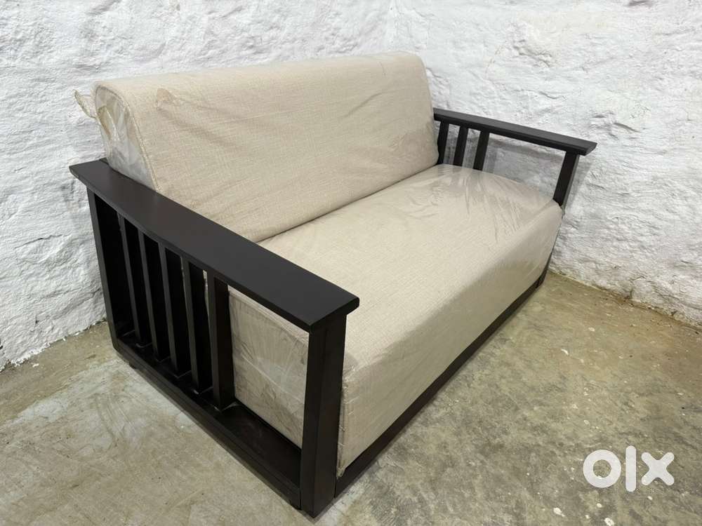 URBAN LADDER : Serra 2 Seater Sheesham Sofa For UPTO 70% OFF SALE.