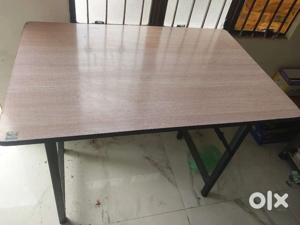 Folding table and study table