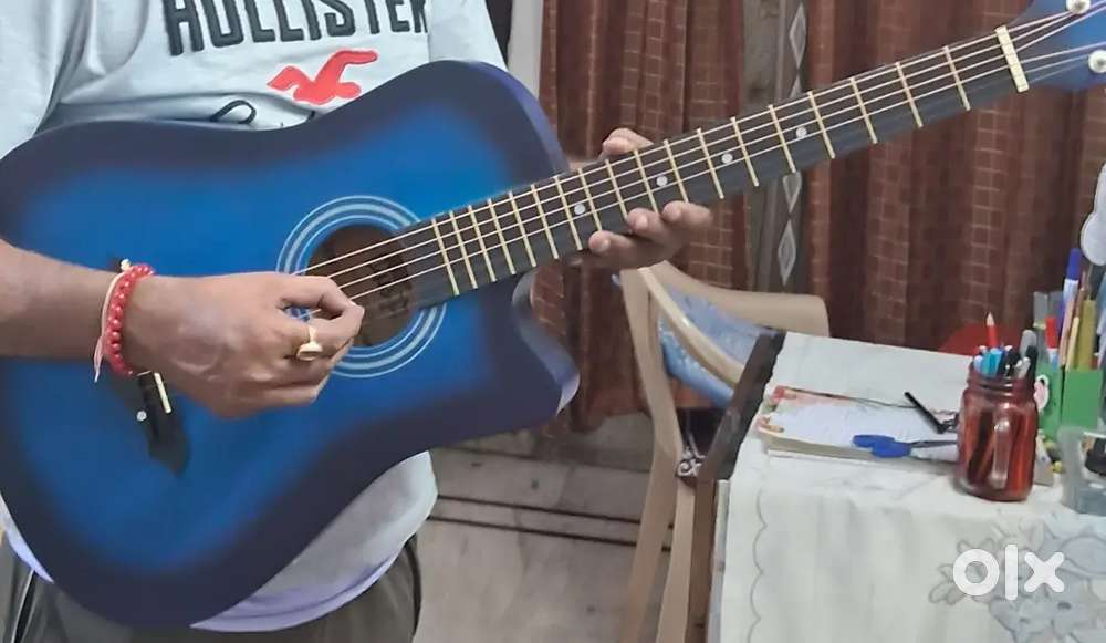 Acoustic beginner guitar for playing and showpiece purpose