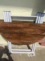 Small diwan two seater rat km ho sakta h and one round table foldable