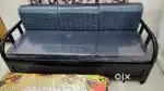Sofa cum bed with center table