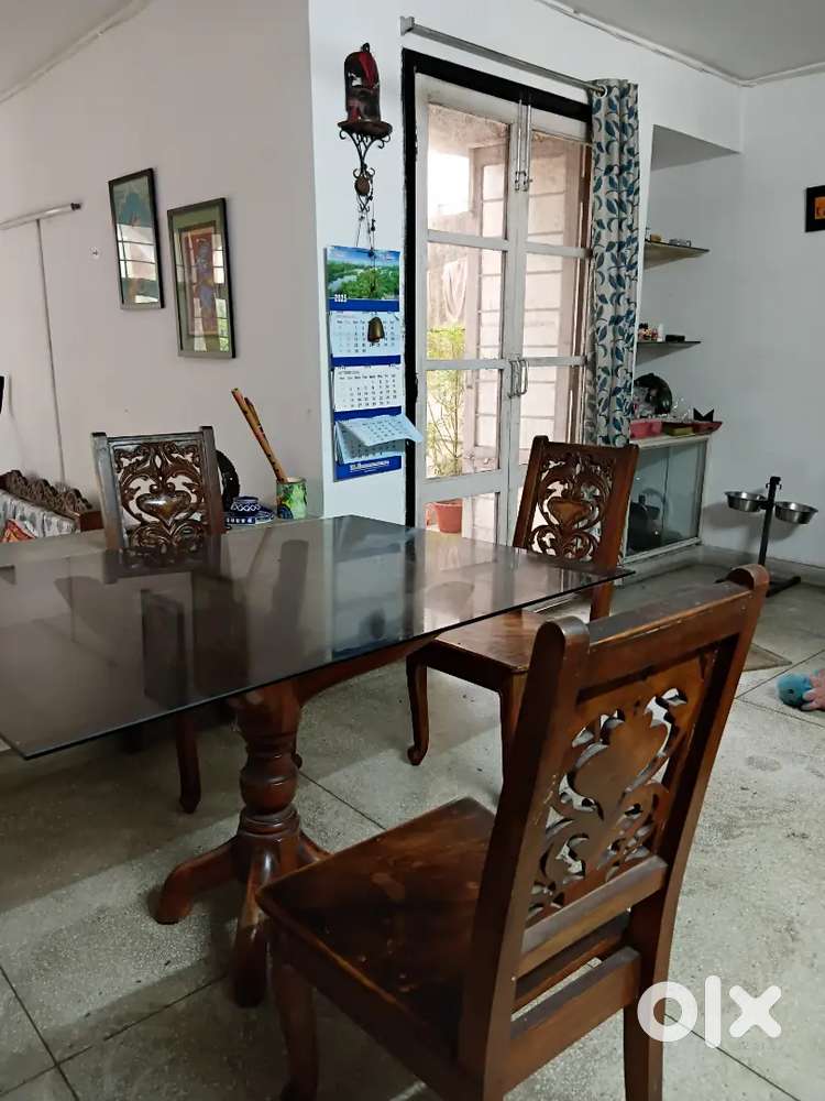 4 seater dining table, glass top,pure teak wood, termite proof