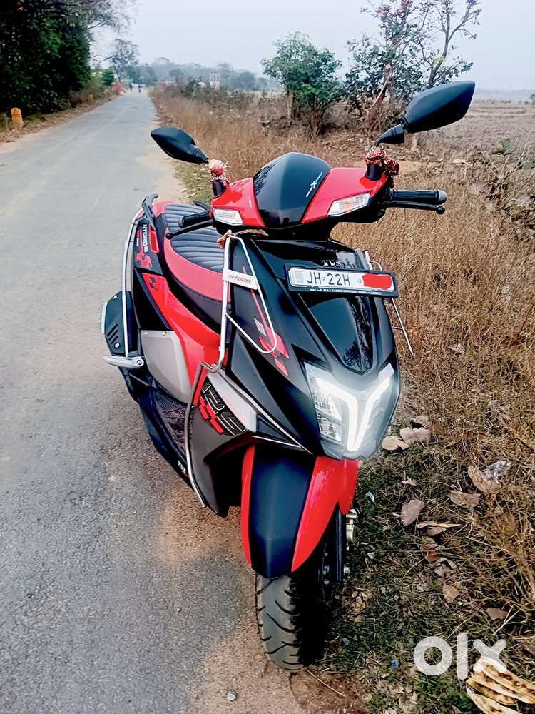 Selling my NTORQ 125 ( black red colour)