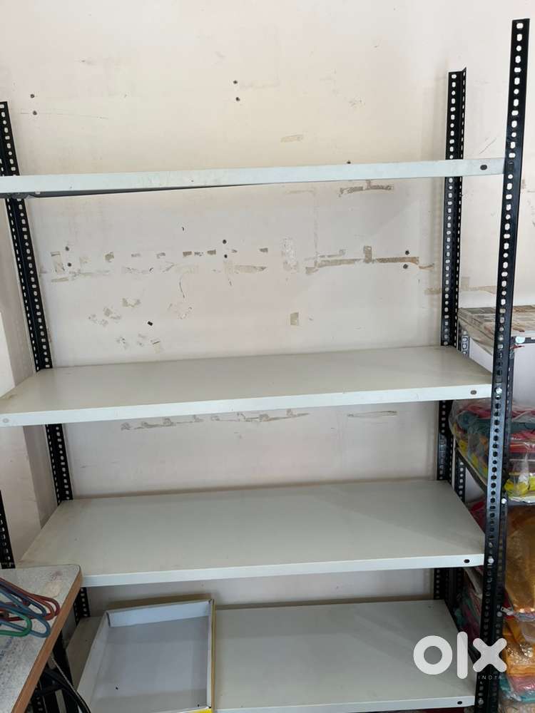 It is made from mild steel (MS) with perforated angles and shelves.