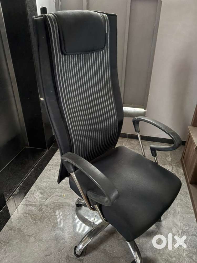 Revolving chair with high back
