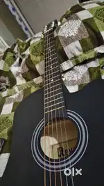 Revel Music Acoustic Guitar with Two plectrum and a Guitar pack bag