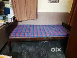Single wooden bed with mattress