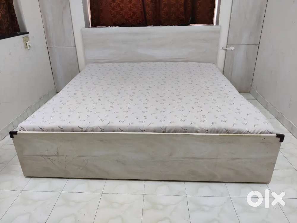 Queen Size Bed slightly more than 6' x 6' with a matching dresser