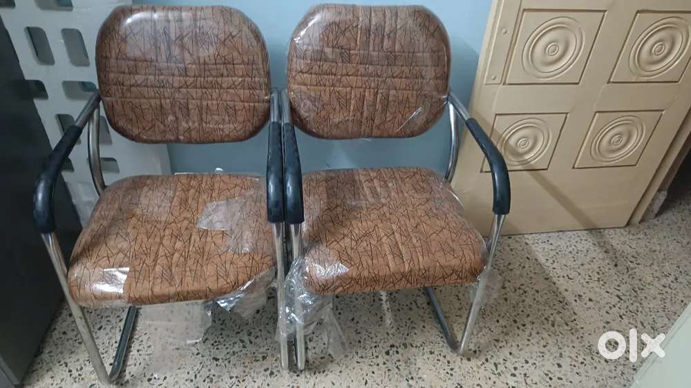 Two brown colour chairs