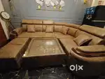 Selling my 5 seater sectional sofa with puffies and glass coffee table