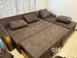L Shape wooden sofa cum bed with cussions and storage