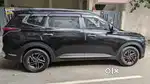 Kia Carens 2023 Petrol well maintained black colour