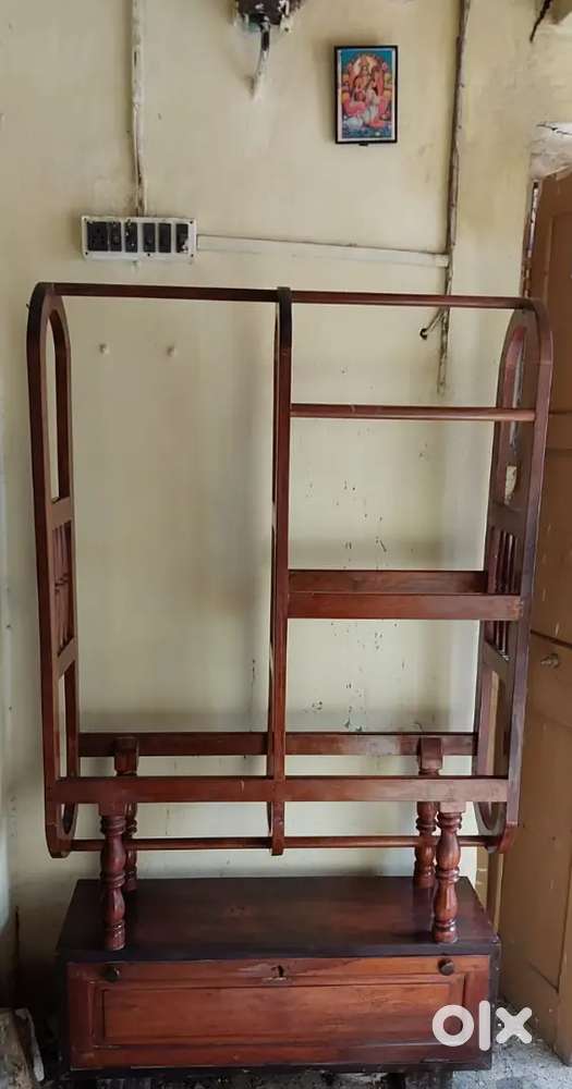 Bed, dressing table, clothes rackand wardrobe .