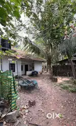 A 4cent plot with a small house near pazhaveedu temple.
