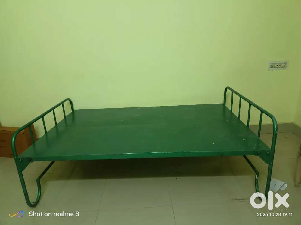 Green iron cot