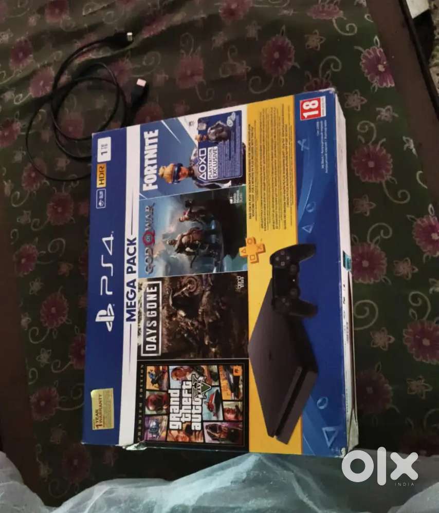 PS4 slim 1TB with box and 2 OG controlers(2 years used)