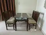 Dinning table with glass top & 4 cushion chairs
