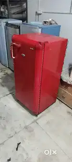 Red colour single door fridge proper working condition