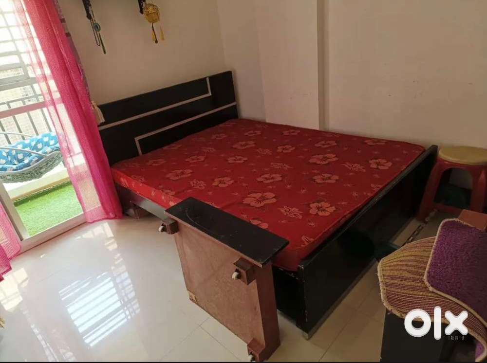 Queen size bed with mattress and storage