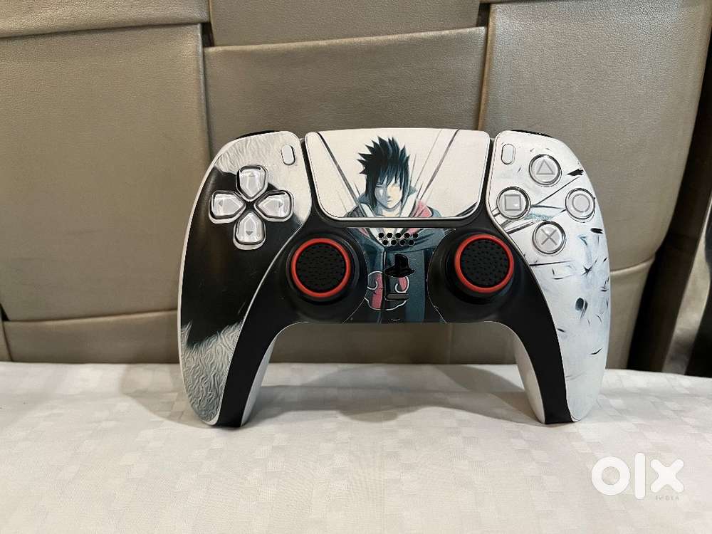 Pre Owned Playstation 5 controller with skin and thumb tips