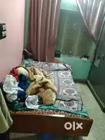 Bed made up of wood with qusen