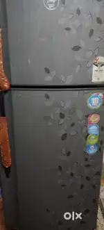 Double door godrej refrigerator with handle.