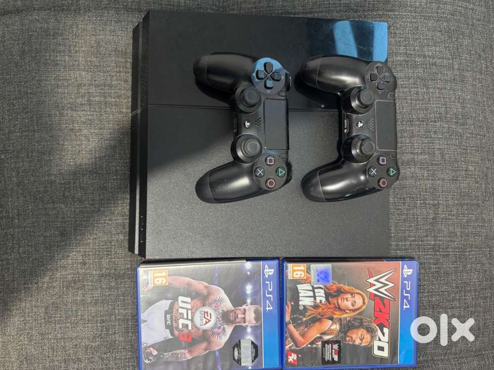 PS4 with 1 controller and 2 games