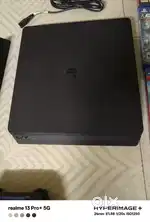 PS4 slim 1tb in very good condition with 12 games and 2 controllers