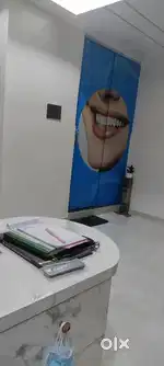 Receptionist at dental clinic and assistant
