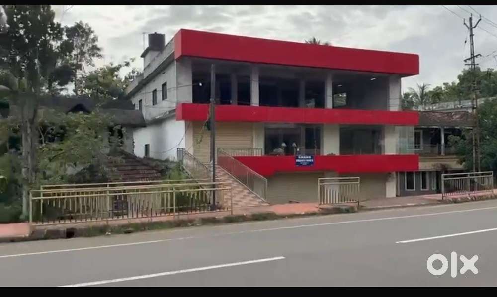 A commercial 3 floor building with 15 cent land in chengannur mc road