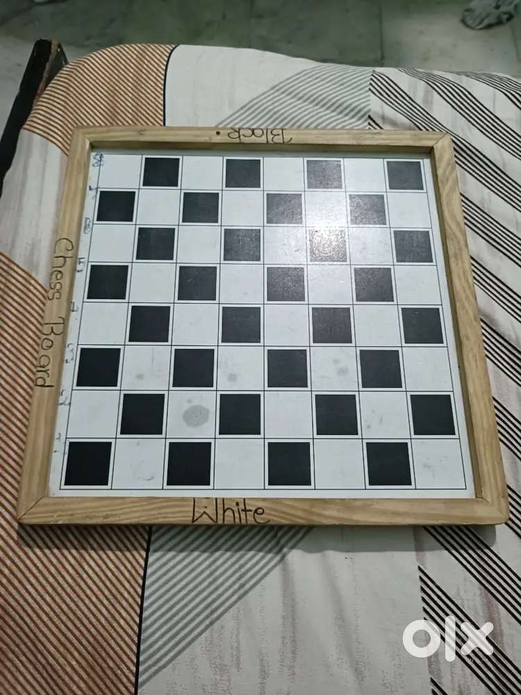 A wooden magnetic chess board with a smooth surface and 2 in 1 games