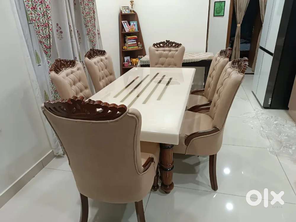 6 chair dinning table and beautiful marble and designing chair