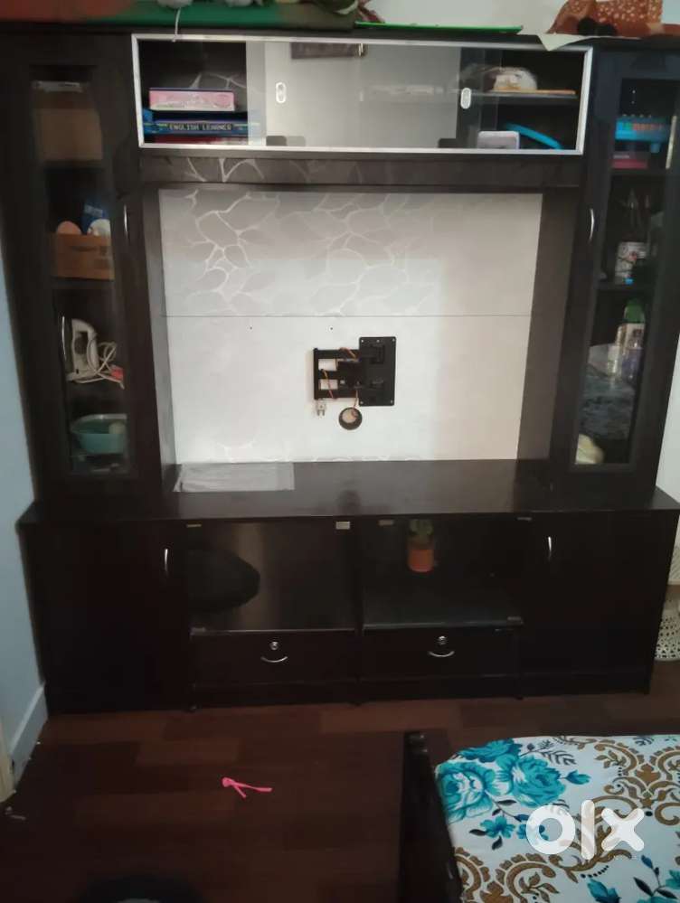 Tv unit, with beautiful light , and queen size spring bed