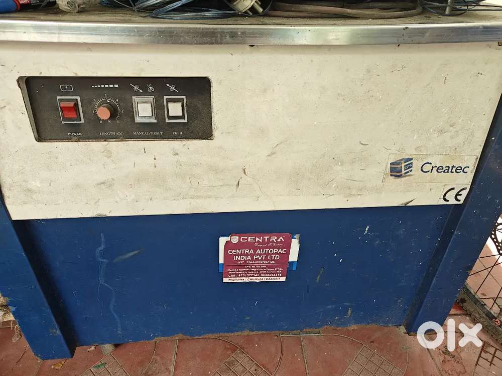 Corton box straping mechine