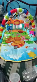 Baby playing mat with toys and sound system
