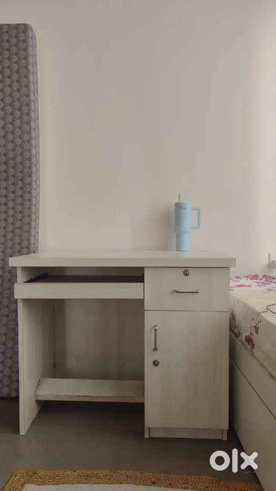 Beautiful white computer table - combines style, space & functionality