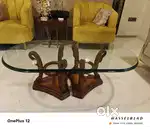 Teak wood centre table with oval shaped 18 mm thick bevelled glass