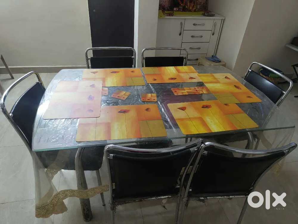 Glass dining table with 6 chairs