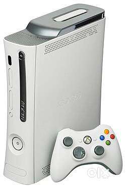 Xbox 360 with games and a controller