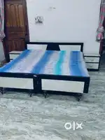 Two Double Beds with side tables.