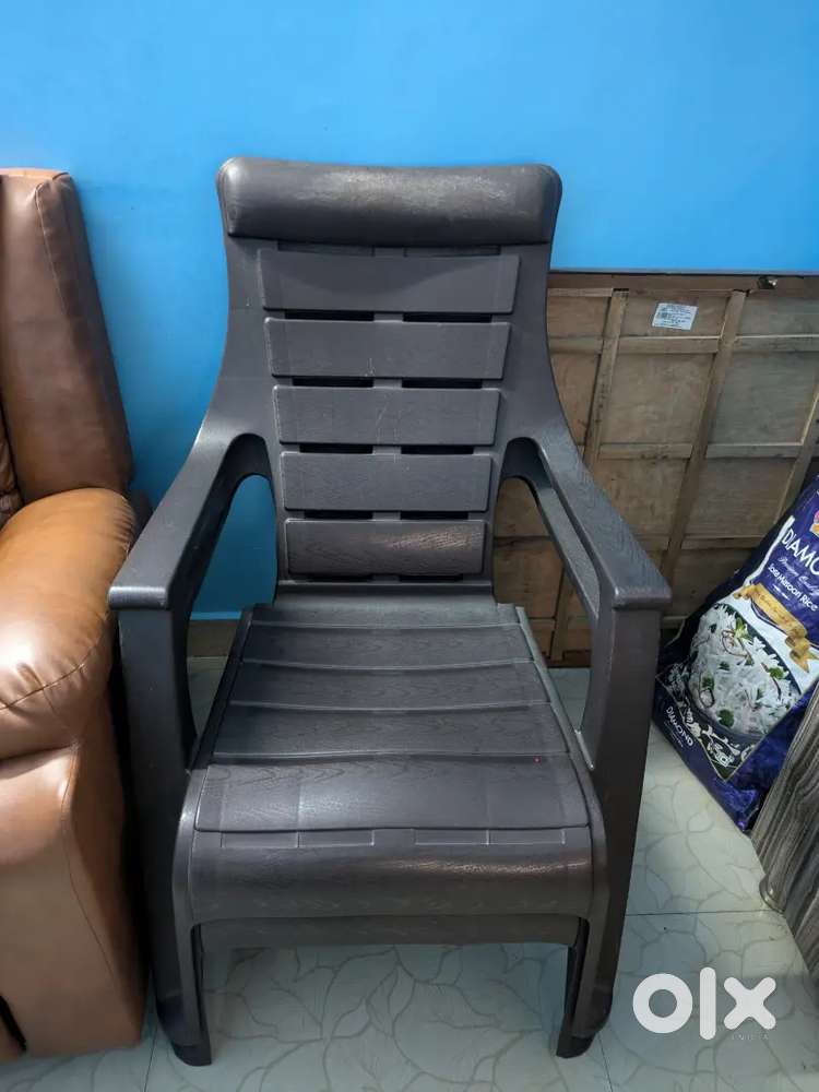 Two plastic chairs and one office chair